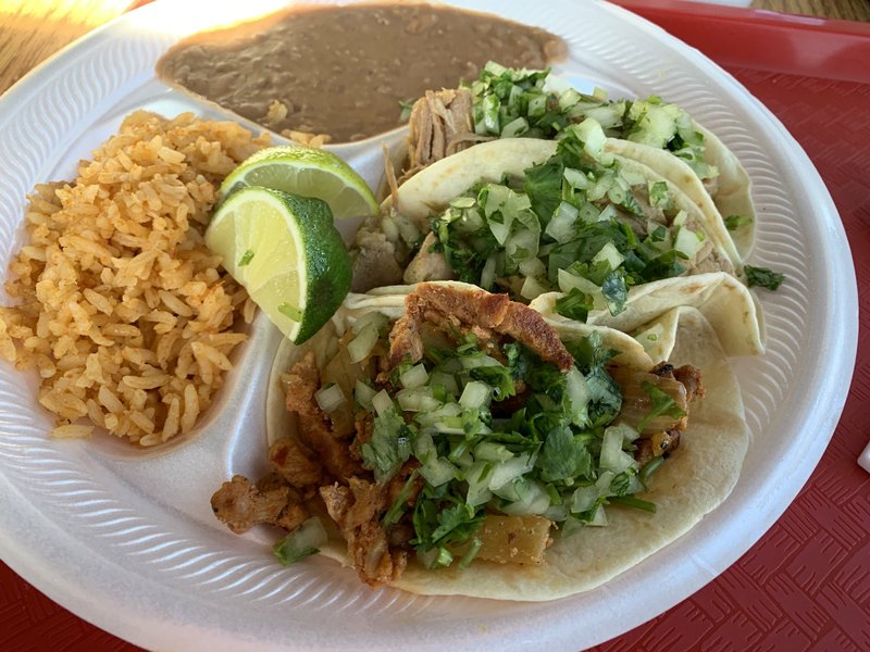 The Combo Street Taco combo includes three tacos -- (from left ) al pastor, chile verde and carnitas -- plus rice and beans at Taqueria Azteca. Arkansas Democrat-Gazette/Eric E. Harrison
