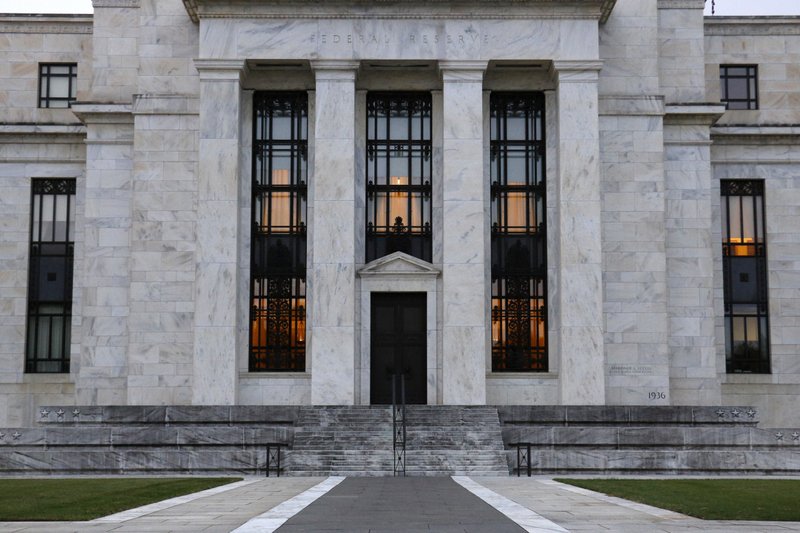 This July 31, 2019 file photo shows the Federal Reserve Building in Washington. The Federal Reserve says corporate debt remains at historically high levels but overall the U.S. financial system is resilient, a view in sharp contrast to the problems that led to the 2008 financial crisis. (AP Photo/Patrick Semansky, File)