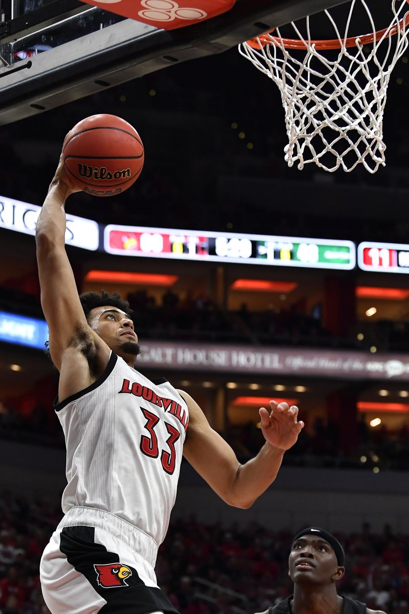 Louisville forward Jordan Nwora (33) goes up for a layup during the second half of Wednesdays' game against South Carolina Upstate in Louisville, Ky. Louisville won 76-50. - Photo by Timothy D. Easley of The Associated Press