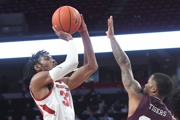 Jimmy Whitt shoots over a Texas Southern defender in Arkansas' 82-51 win over the Tigers on Tuesday, Nov. 19, 2019 at Bud Walton Arena in Fayetteville.
