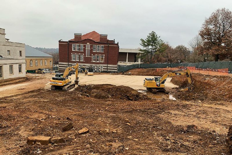Work continues Thursday at the site of the planned student success center just north of Old Main on the University of Arkansas campus in Fayetteville. 