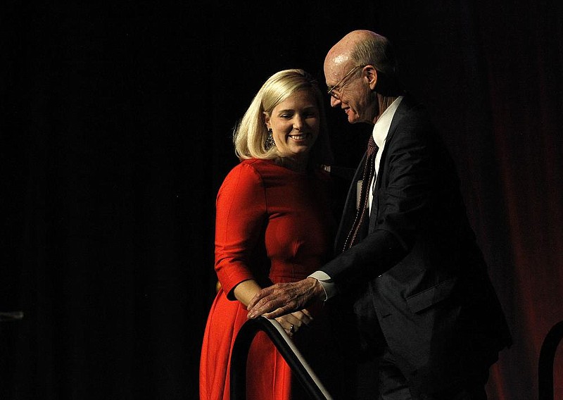 FILE - Arkansas Democrat-Gazette/THOMAS METTHE --
Arkansas Democrat-Gazette publisher Walter E. Hussman Jr. hugs his daughter, Eliza Hussman Gaines, as she leaves the stage during the 200th Anniversary celebration of the Arkansas Gazette on Thursday, Nov. 21, 2019, at the Statehouse Convention Center in Little Rock. Gaines is now the paper's executive editor.