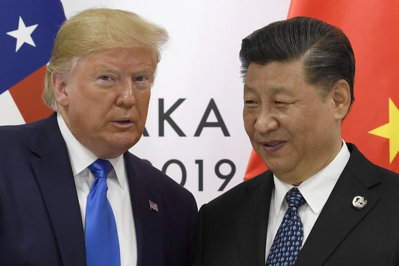  In this June 29, 2019, file photo, U.S. President Donald Trump poses for a photo with Chinese President Xi Jinping during a meeting on the sidelines of the G-20 summit in Osaka, western Japan.  
(AP Photo/Susan Walsh, File)