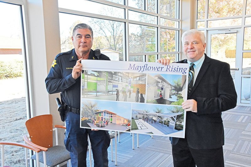 Mayflower Police Chief Robert Alcon, left, and Mayor Randy Holland hold architectural drawings of the new $1.5 million Mayflower City Center municipal building as they stand inside it. A ribbon cutting is scheduled for 2 p.m. Tuesday for the facility, No. 5 Ashmore Drive. The building, paid for almost entirely with grants, includes the police department, courtroom/community room, mayor’s office and economic-development room.
