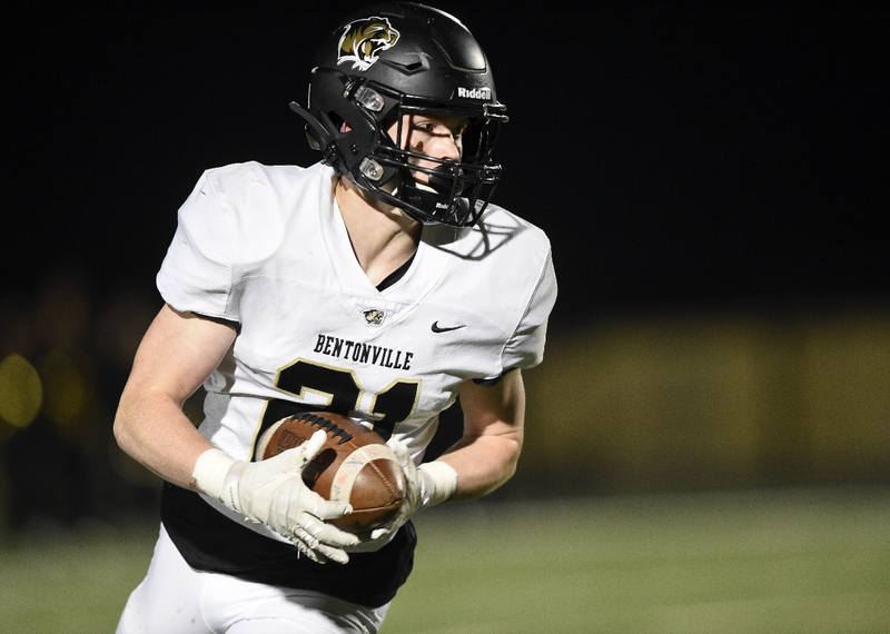 Bentonville wide receiver Trenton Kolb (21) carries the ball, Friday, November 8, 2019 during a football game at Bentonville West High School in Centerton.