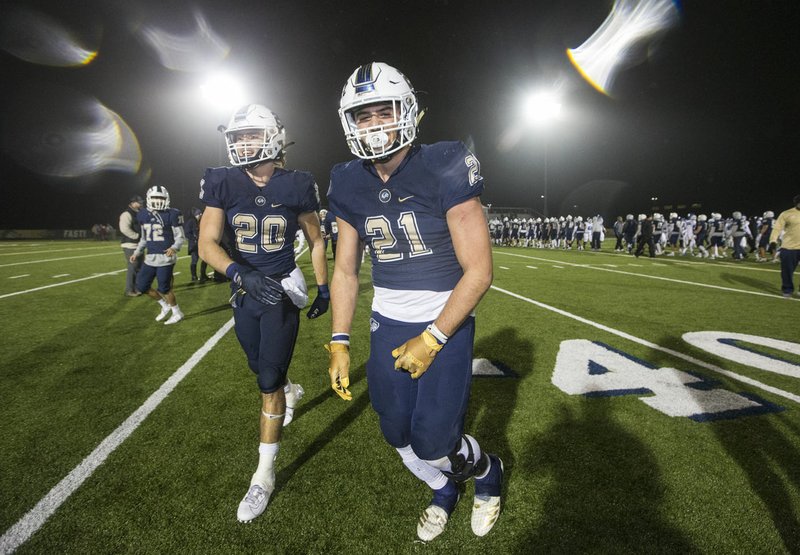 NWA Democrat-Gazette/BEN GOFF @NWABENGOFF Nick Whitlatch (20) and Jonas Higson, Bentonville West running backs, celebrate Friday, Nov. 22, 2019, after defeating Conway 31-21 at Wolverine Stadium in Centerton.