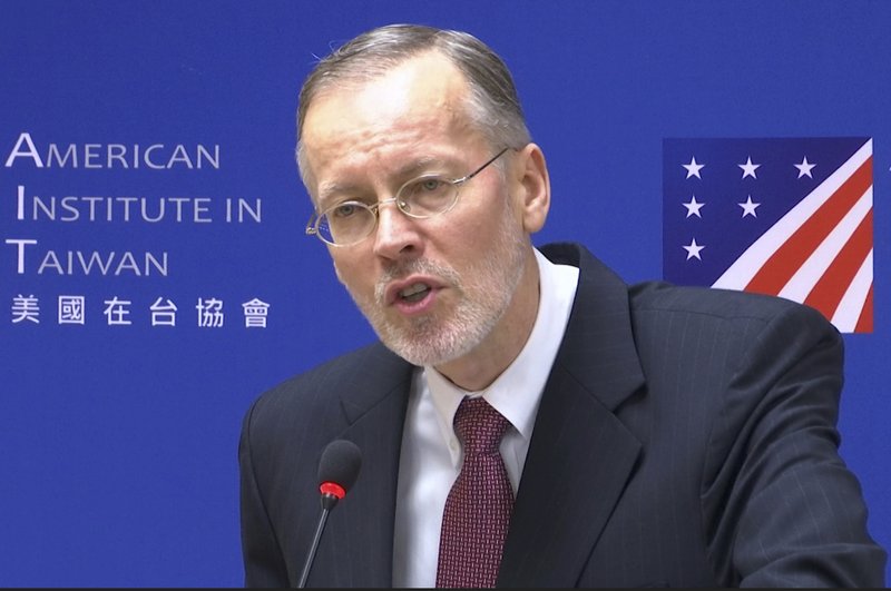 FILE - In this file image made from video taken Oct. 31, 2018, the American Institute in Taiwan Director Brent Christensen speaks during a press conference in Taipei, Taiwan, Christensen said on Friday, Nov. 22, 2019, that Washington is working with Taipei to combat efforts by Beijing to influence upcoming elections on the island. (AP Photo)