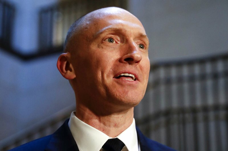 FILE - In this Nov. 2, 2017, photo, Carter Page, a foreign policy adviser to Donald Trump's 2016 presidential campaign, speaks with reporters following a day of questions from the House Intelligence Committee, on Capitol Hill in Washington.