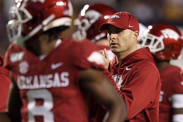 Arkansas interim head coach Barry Lunney Jr. is shown during warmups prior to a game against LSU on Saturday, Nov. 23, 2019, in Baton Rouge, La. 