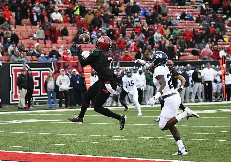 Arkansas State wide receiver Omar Bayless (7) catches a 32-yard touchdown pass in front of Georgia Southern’s Donald Rutledge Jr. during the Red Wolves’ 38-33 victory Saturday at Centennial Bank Stadium in Jonesboro. Bayless caught seven passes for 113 yards and set the Sun Belt Conference record for the most receiving yards in a single season (1,375).