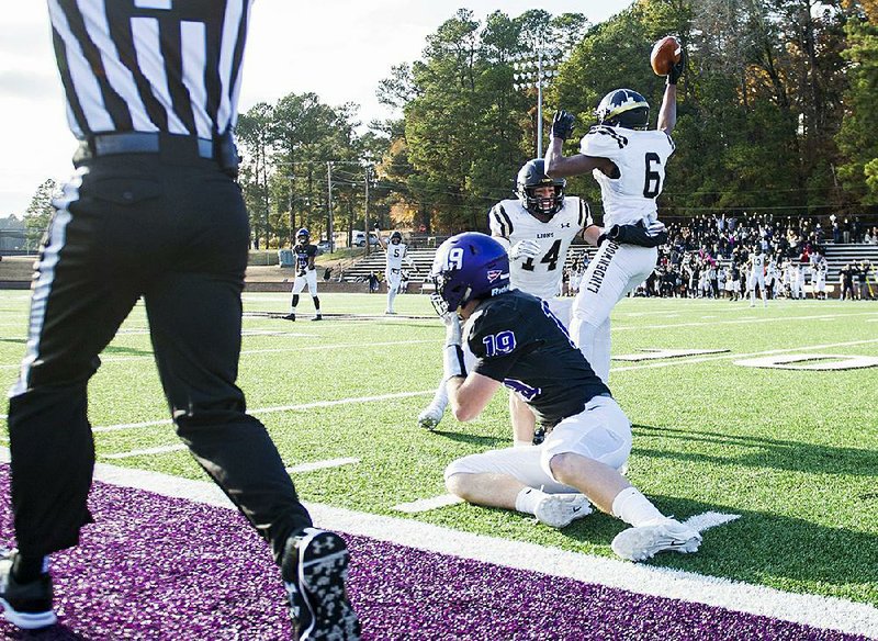 Ouachita Baptist wide receiver Justin Dean (19) watches as Lindenwood defensive back Jordan Perry (6) celebrates with team- mate Grady Daniels after an interception during the Tigers’ 41-38 loss in the NCAA Division II playoffs at Cliff Harris Stadium in Arkadelphia. More photos are available at arkansasonline.com/1124obuplayoff.