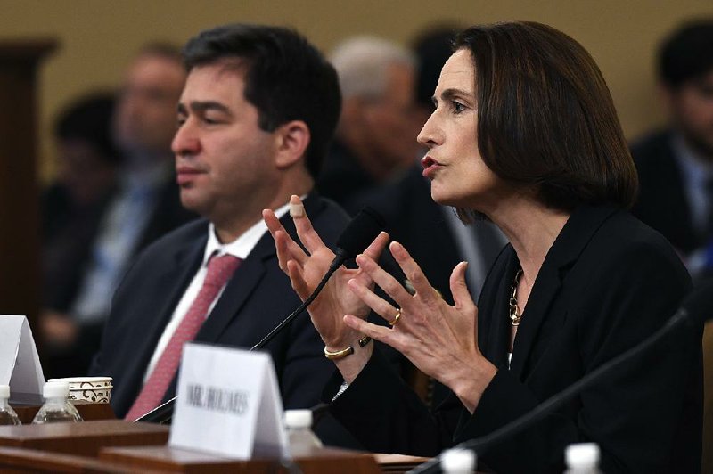 Former White House national security aide Fiona Hill, sitting with her lawyer Lee Wolosky, said at Thursday’s impeachment hearings that the theory that Ukraine interfered in the 2016 election “is a fictional narrative.” 