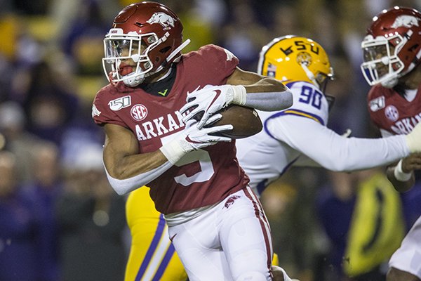 Arkansas running back Rakeem Boyd carries the ball during a game against LSU on Saturday, Nov. 23, 2019, in Baton Rouge, La.