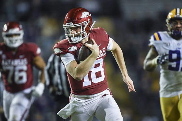 Arkansas quarterback Jack Lindsey carries the ball during a game against LSU on Saturday, Nov. 23, 2019, in Baton Rouge, La. 