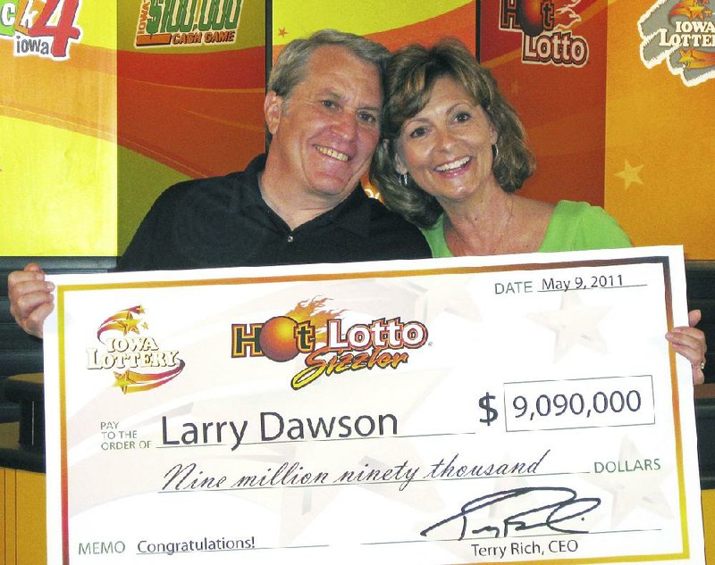 Larry Dawson and his wife, Kathy, are shown claiming their Hot Lotto jackpot in Des Moines, Iowa, in this May 2011 photo provided by the Iowa Lottery. 