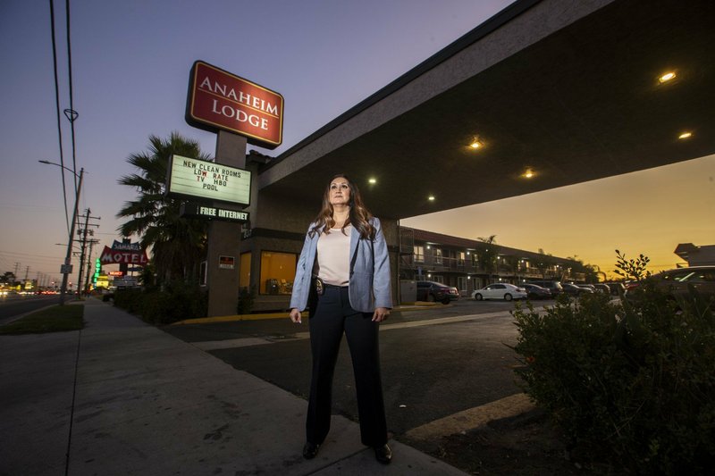 Anaheim Police Detective Julissa Trapp stands in front of the Anaheim Lodge in Anaheim, where murder victim Jarrae Estepp, 21, of Ardmore, Okla., left her belongings in room 217. The case is explored in Detective Trapp. (Photo by Allen J. Schaben, via Los Angeles Times)