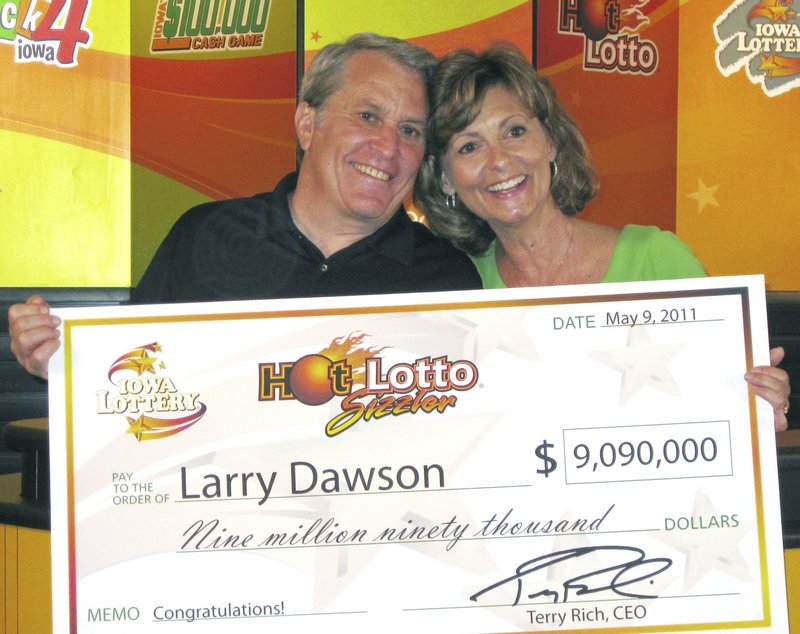 The Associated Press LOTTERY WINNER: This May 9, 2011 photo provided by the Iowa Lottery shows Larry Dawson and his wife, Kathy, claiming their $9.09 million Hot Lotto jackpot in Des Moines. A national lottery group rocked by an insider's jackpot-rigging conspiracy has settled a lawsuit brought by the Iowa grandfather who said the $9 million prize he won in 2011 should have been nearly three times as big. The Multi-State Lottery Association and Dawson informed a judge of the settlement this month, cancelling a trial that had been scheduled to begin next week in Des Moines, Iowa. story.lead_photo.caption