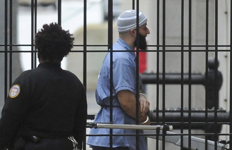 FILE - In this Feb. 3, 2016 file photo, Adnan Syed enters Courthouse East in Baltimore prior to a hearing. Supreme Court justices on Monday left in place a Maryland court ruling that denied a new trial to Adnan Syed, who was convicted of strangling a high school classmate he had once dated.(Barbara Haddock Taylor/The Baltimore Sun via AP)