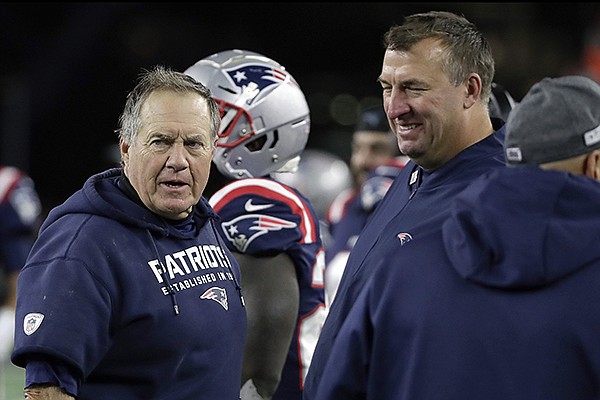 New England Patriots head coach Bill Belichick, left, speaks with defensive line coach Bret Bielema on the sideline in the second half of an NFL football game against the New York Giants, Thursday, Oct. 10, 2019, in Foxborough, Mass. (AP Photo/Elise Amendola)


