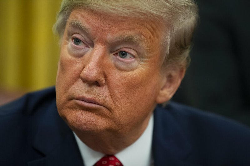 President Donald Trump listens during an event to sign an executive order establishing the Task Force on Missing and Murdered American Indians and Alaska Natives, in the Oval Office of the White House, Tuesday, Nov. 26, 2019, in Washington. (AP Photo/ Evan Vucci)