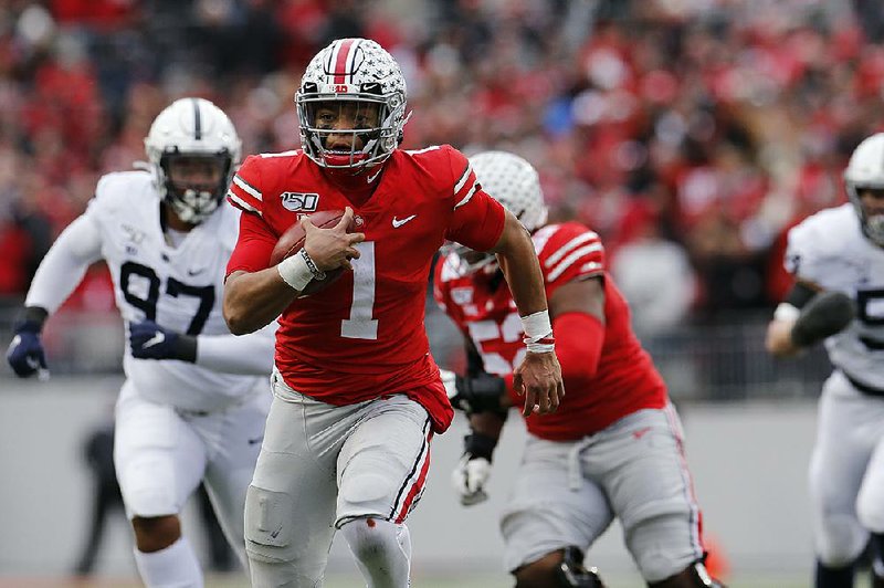 Quarterback Justin Fields (1), who transferred from Georgia, leads top-ranked Ohio State against No. 14 Michigan and another transfer quarterback, Shea Patterson. 