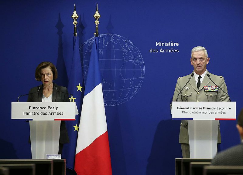 French Defense Minister Florence Parly (left) and Army Chief of Staff Gen. Francois Lecointre hold a news conference Tuesday in Paris after the helicopters’ fatal collision in Mali. 
