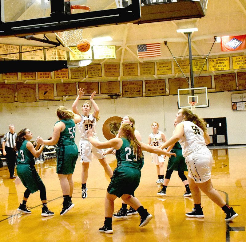 MARK HUMPHREY ENTERPRISE-LEADER Prairie Grove sophomore Abby Preston fires off a shot in the lane during the seventh place game Saturday, Nov. 16, at the Duel of the Dome tournament hosted by West Fork. Prairie Grove defeated Greenland, 41-27, to notch the first win of the season for girls basketball.