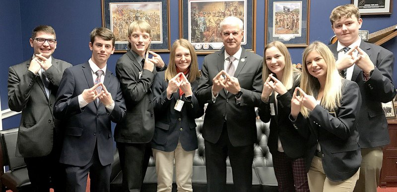 Photograph submitted From left, Evan Larsen, Austin Miller, Jake Taylor, Emily Beck, Congressman Steve Womack, Riley Robbins, Tessa Kelley, Jacob Dixon 