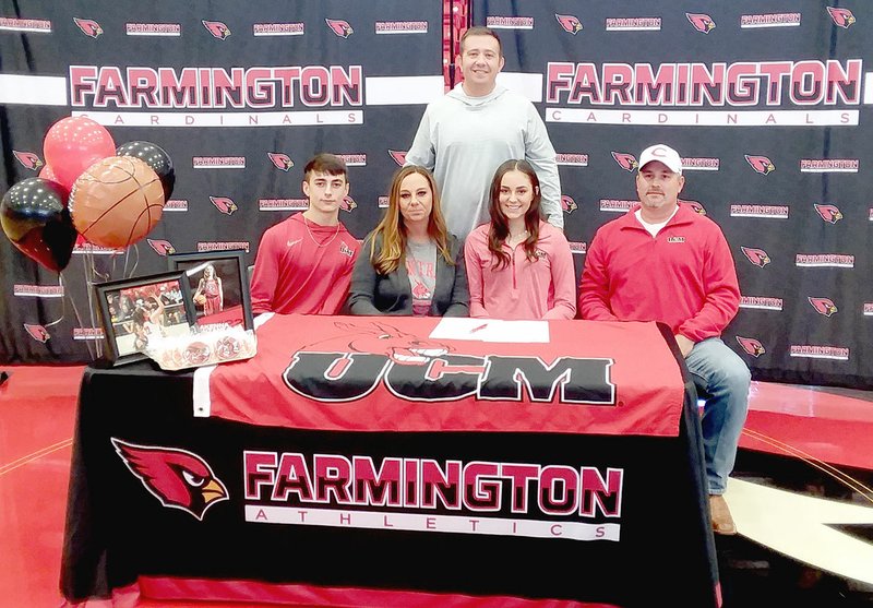 MARK HUMPHREY ENTERPRISE-LEADER Farmington senior Makenna Vanzant signed a national letter of intent to play women's college basketball for Central Missouri on Friday, Nov. 15 at Cardinal Arena. Makenna was accompanied by her family (from left): brother, Cameron Vanzant; mother Monica Vanzant; Makenna; and father, Ryan Vanzant; along with Farmington head coach Brad Johnson (standing). See story on Page 2B.