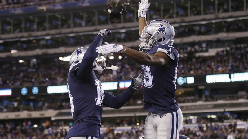 Dallas Cowboys wide receiver Michael Gallup (13) celebrates with wide receiver Amari Cooper (19) after scoring a touchdown during the fourth quarter of an NFL football game against the New York Giants, Monday, Nov. 4, 2019, in East Rutherford, N.J. (AP Photo/Adam Hunger)
