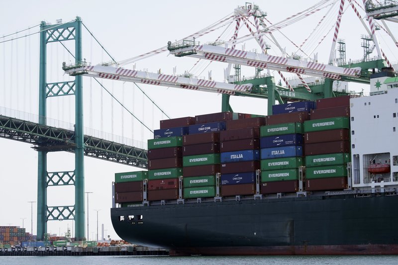 FILE - In this June 19, 2019, file photo a cargo ship is docked at the Port of Los Angeles in Los Angeles. On Wednesday, Nov. 27, the Commerce Department issues the second estimate of how the U.S. economy performed in the July-September quarter. (AP Photo/Marcio Jose Sanchez, File)

