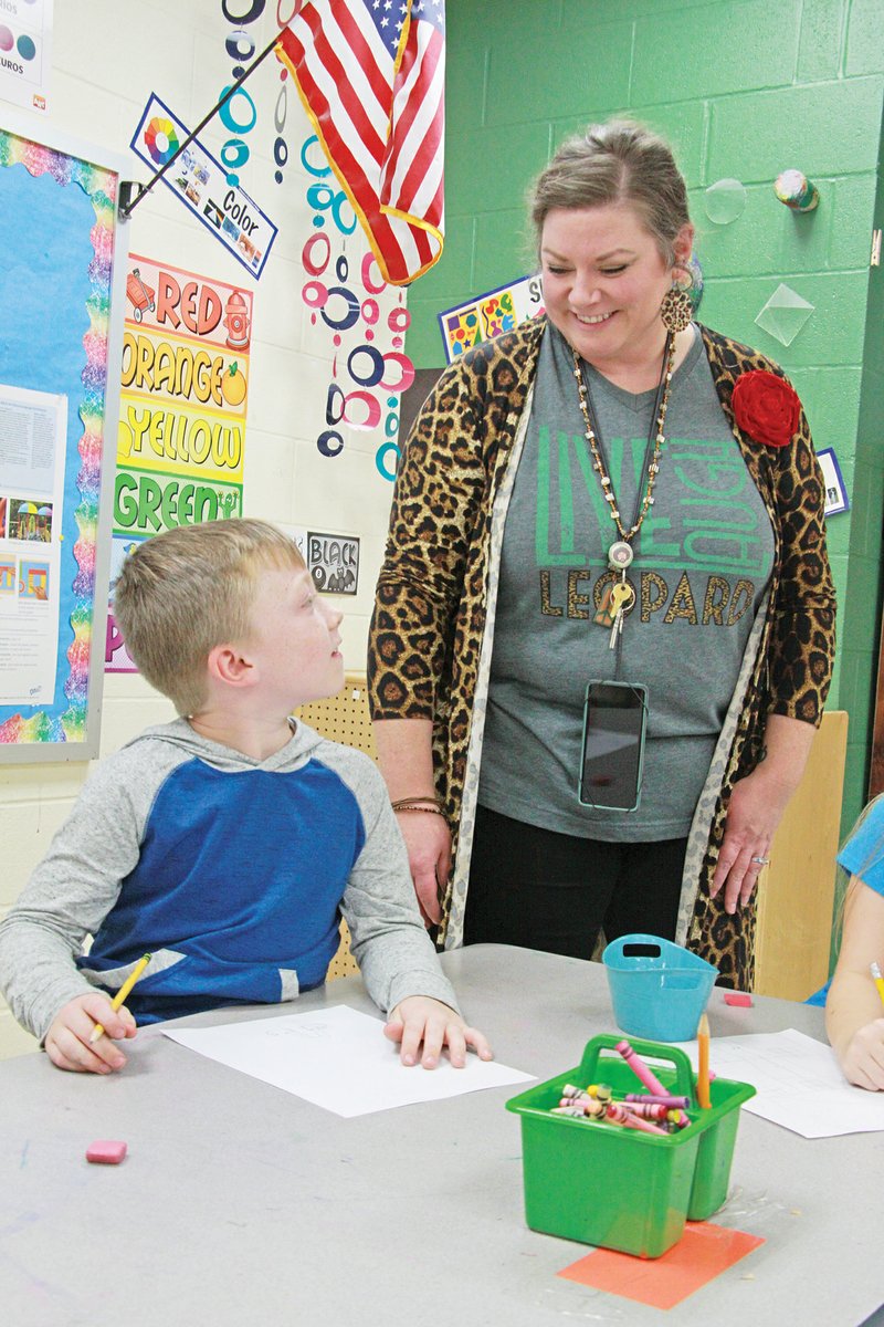 Bay Bramlett, a second-grader at Sheridan Elementary School, listens to Jeri Newberry during an art class Nov. 19. Newberry was named Elementary Art Educator of the Year at the state’s Art Educators Fall Conference on Nov. 7 in Little Rock.