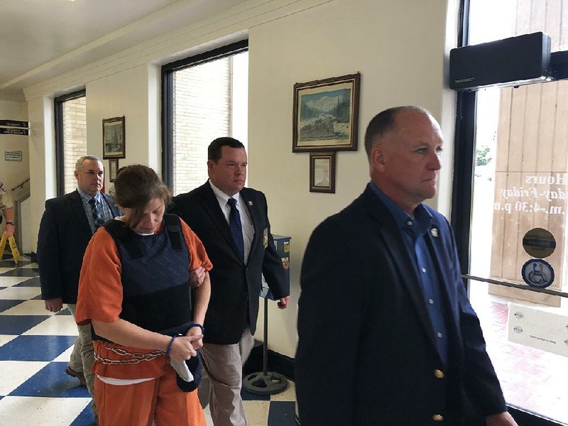 Rebecca Lynn O’Donnell is escorted out of the Randolph County Courthouse on July 30 after she was arraigned in former state Sen. Linda Collins’ slaying. 