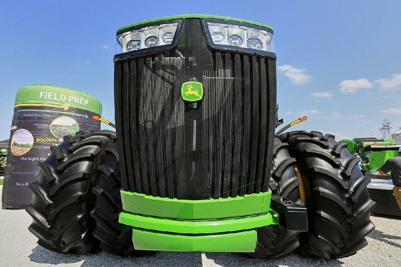 Tractor and construction equipment maker Deere and Co. has projected profits in 2020 of $2.7 billion to $3.1 billion, less than this year, citing U.S.-China trade tensions and bad weather that hurt farmers who buy the machinery. 