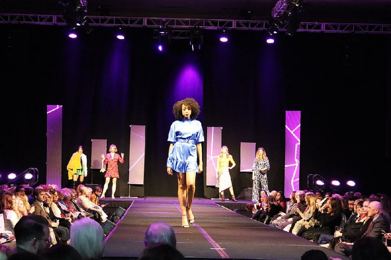 Fashions by B. Barnett light up the runway at the Festival of Trees’ Festival of Fashion on Nov. 15. 