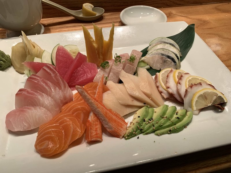 A large sashimi plate at Kobe includes at least 21 pieces of fish, in this case (clockwise from left) red snapper, tuna, yellowtail, mackerel, octopus, escolar, crab stick and salmon. Arkansas Democrat-Gazette/Eric E. Harrison