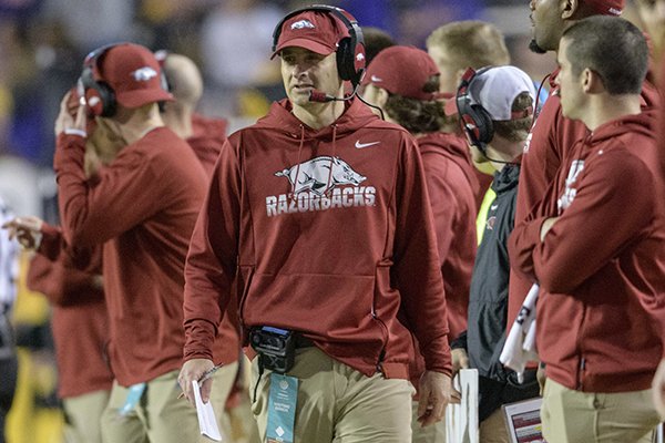 Arkansas coach Barry Lunney, Jr., walks the sidelines against LSU in an NCAA college football game in Baton Rouge, La., Saturday, Nov. 23, 2019. (AP Photo/Matthew Hinton)