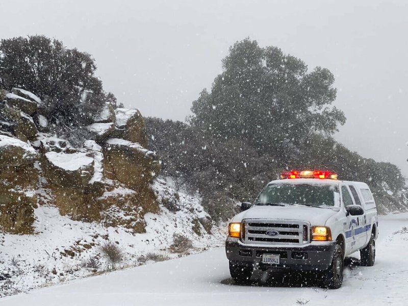 This photo tweeted by the Santa Barbara County Fire Department shows a Santa Barbara Fire Department truck along E. Camino Cielo as snow falls at the 3,500 foot level on the fire footprint in Santa Barbara, Calif. Thursday, Nov. 28, 2019.