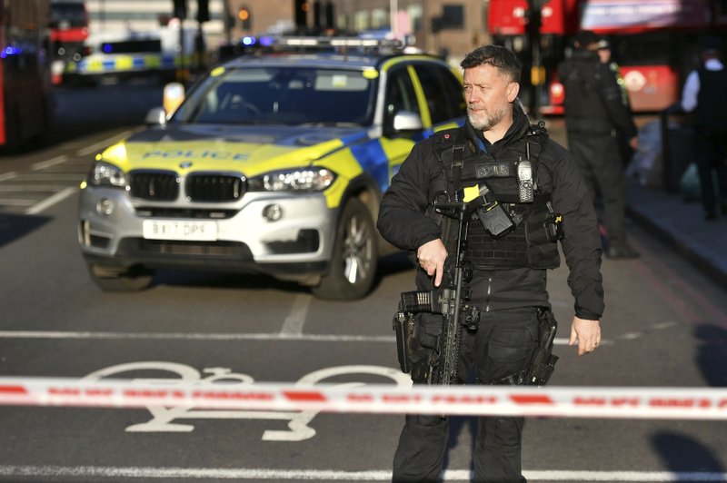 Police at the scene of an incident on London Bridge in central London following a police incident, Friday, Nov. 29, 2019. British police said Friday they were dealing with an incident on London Bridge, and witnesses have reported hearing gunshots. The Metropolitan Police force tweeted that officers were “in the early stages of dealing with an incident at London Bridge.” (Dominic Lipinski/PA via AP)

