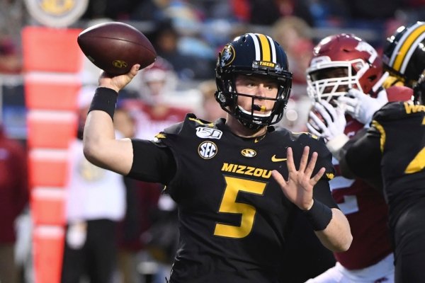 Missouri quarterback Taylor Powell drops back to pass against Arkansas during the second half of an NCAA college football game Friday, Nov. 29, 2019, in Little Rock, Ark. (AP Photo/Michael Woods)
