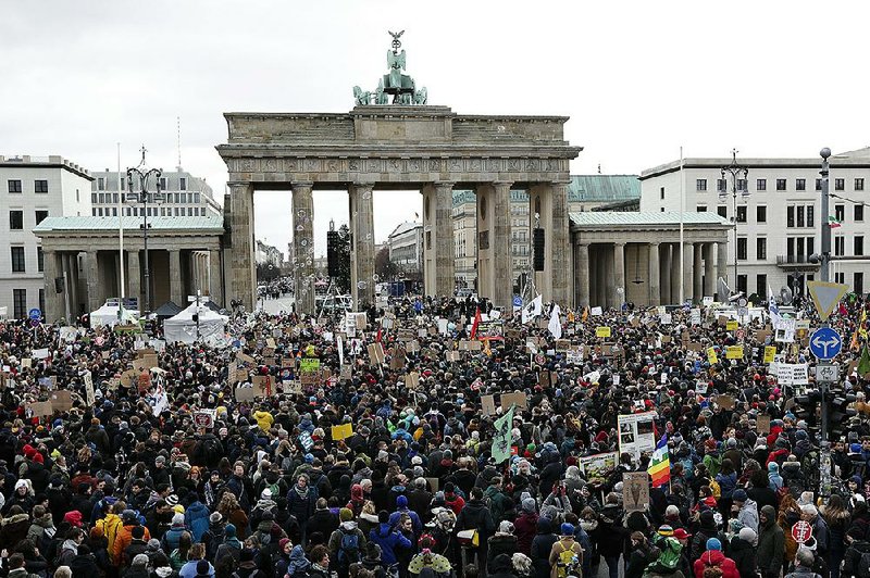 Thousands of young people attend a rally staged by the Fridays for Future movement in front of the Brandenburg Gate in Berlin. 
