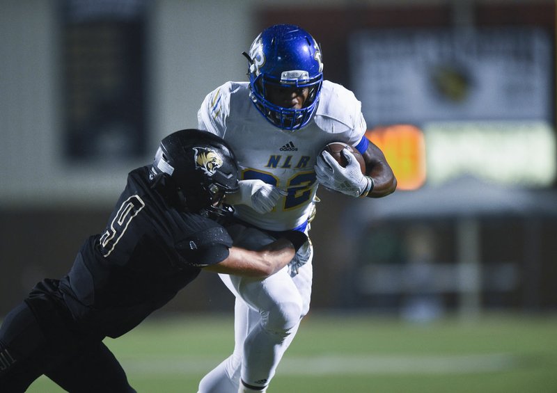 NWA Democrat-Gazette/CHARLIE KAIJO North Little Rock running back Brandon Thomas (22) carries the ball, Friday, November 29, 2019 during the Class 7A semifinal at Bentonville High School in Bentonville.