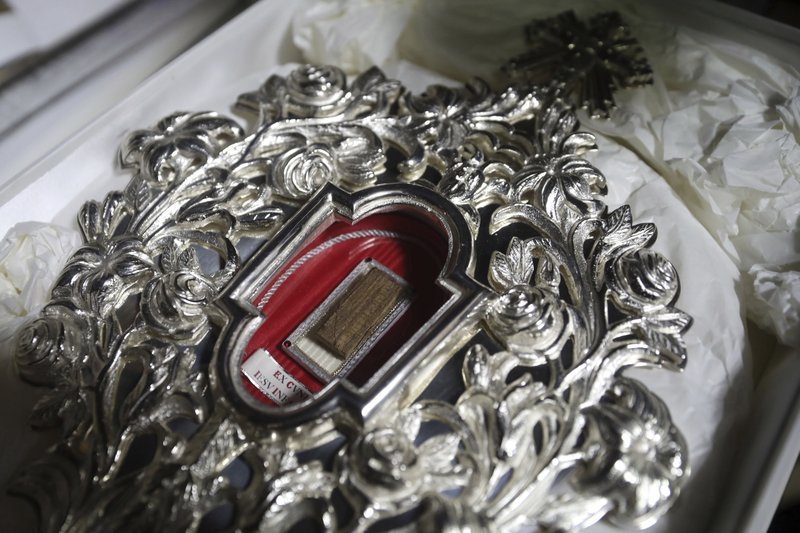 A wooden relic believed to be from Jesus' manger is seen at the Notre Dame church in Jerusalem on Friday. Christians are celebrating the return to the Holy Land of a tiny wooden relic believed to be from Jesus' manger nearly 1,400 years after it was sent to Rome as a gift to the pope. - AP Photo/Mahmoud Illean story.lead_photo.caption