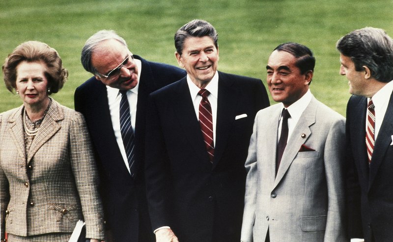 In this May 3, 1985, file photo, then Japan's Prime Minister Yasuhiro Nakasone, second right, then British Prime Minister Margaret Thatcher, left, then West German Chancellor Helmut Kohl, second left, then U.S. President Ronald Reagan, center, and then Canada's Prime Minister Brian Mulroney pose for a group photo during the World Economic Summit in the garden of Palais Schaumburg in Bonn. Nakasone, a giant of his country's post-World War II politics who pushed for a more assertive Japan while strengthening military ties with the United States, died on Friday. He was 101. - AP Photo/File
