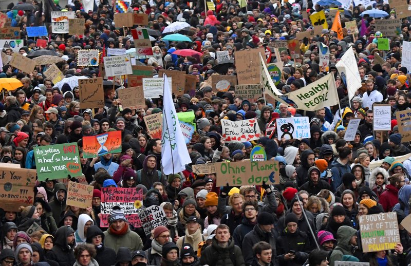 Thousands of demonstrators attend a protest and climate strike rally of the Fridays for Future movement in Leipzig, Germany, on Friday. - AP Photo/Jens Meyer