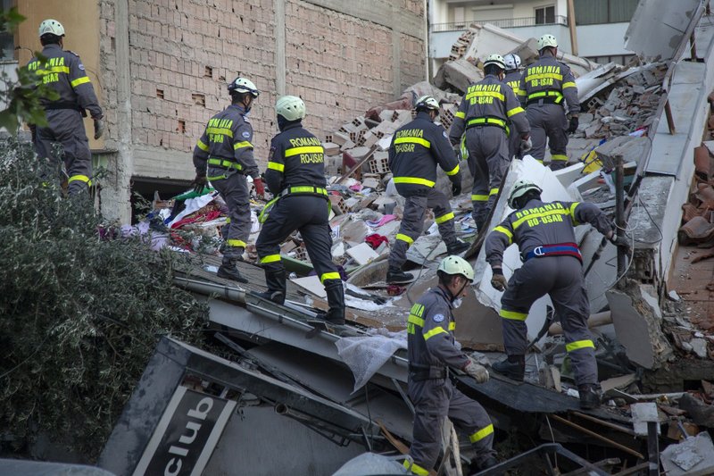 Rescuers from Romania operate at a collapsed building Wednesday after the 6.4-magnitude earthquake in Durres, western Albania. In the initial hours after a deadly pre-dawn earthquake struck Albania, pancaking buildings and trapping dozens of sleeping people beneath the rubble, the country's neighbors sprang into action. Offers of help flooded in from across Europe and beyond, with even traditional foes setting aside their differences in the face of the natural disaster. The 6.4-magnitude earthquake that struck Albania on Tuesday killed at least 49 people, injured 2,000 and left at least 4,000 homeless. - AP Photo/Visar Kryeziu