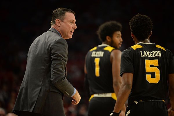 Northern Kentucky coach Darrin Horn directs his team Saturday, Nov. 30, 2019, during the first half of play against Arkansas in Bud Walton Arena.