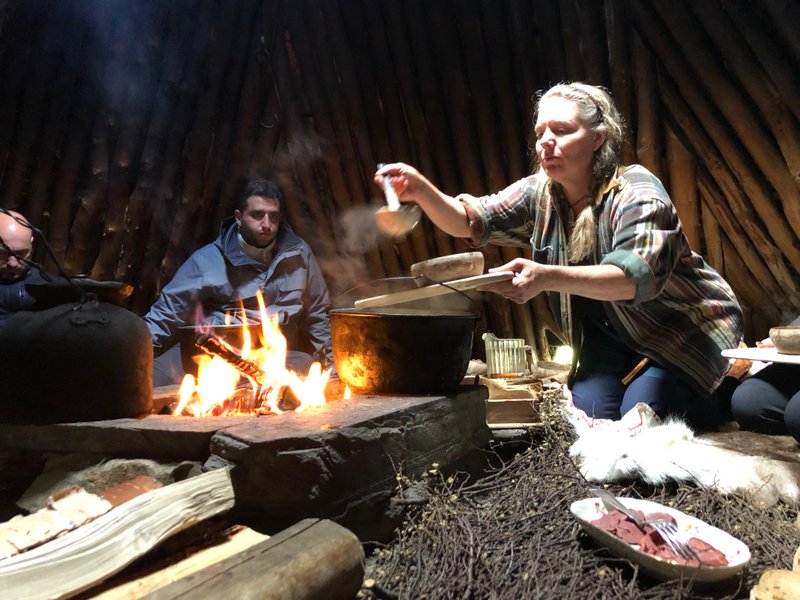 Anki Vinka serves lunch inside a traditional Sami tepee-like structure called a goathie. (Photo by Mark Johanson via TNS/Chicago Tribune) 