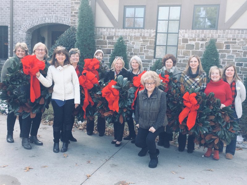 Courtesy Photo Members of the Maple Hills Garden Club met recently to make magnolia wreaths for Headquarters House, the Dickson Street home of the Washington County Historical Society. Pictured are members (from left) Imelda McClinton, Jana Ferguson, Gayle Howard, Anita Backus, Doris Ann Kisor, Vickie Rae Parker, Lynda Spencer, Dee Dee Lamb, Diana Page, Melanie Faught, Carol Eaton and Lynn Sheridan. Information: Email lynnsheridan03@gmail.com. story.lead_photo.caption