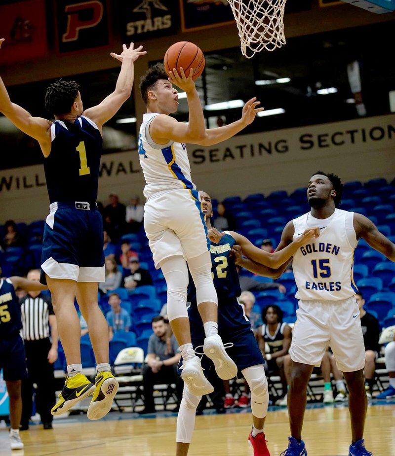 Photo courtesy of JBU Sports Information John Brown junior Kiree Hutchings goes up for a shot during Tuesday's game against Champion Christian at Bill George Arena.